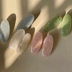Lot de barrettes ovales en résine aux tons pastels avec incrustation de copeaux de bois