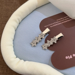 Set de barrettes étoile étincelantes en métal argenté avec cristaux blancs brillants