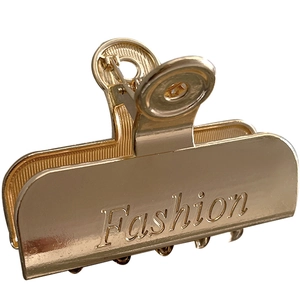 Elegante molletta per capelli in metallo dorato con logo Fashion inciso a mano