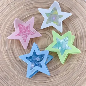 Star-shaped candy color hair clips with glitter finish set on a wooden tray