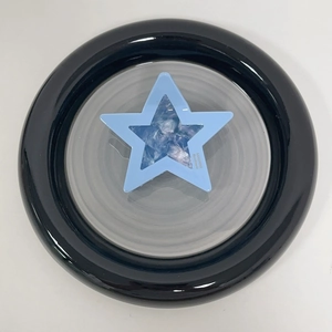 Detail of blue acetate star hair claw clip with crystal inlay and handmade brand text