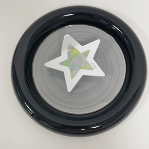 Macro view of holographic star hair claw with SANSHINE Handmade logo detail