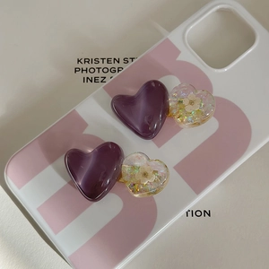 Detail of purple marble resin heart hair clips and transparent floral sequin hair pins