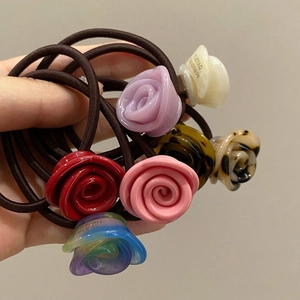 Handheld collection of assorted resin rose hair ties in various colors for women