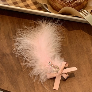 Elegant pink feather hair clip with heart rhinestones and ribbon bow for women