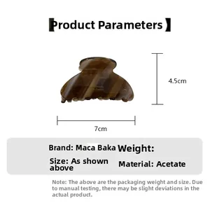 Detailed view of brown tortoiseshell acetate hair claw clip with 7x4.5cm dimensions