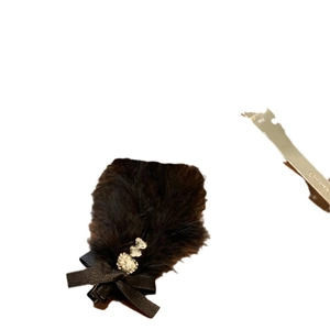 Elegant black faux fur bow hair clip with sparkling rhinestones for winter hair styling