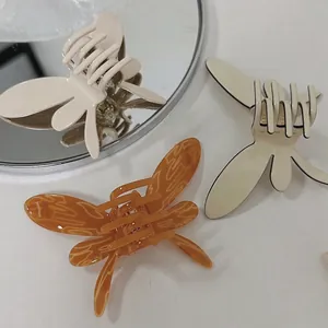 Pinces à cheveux papillon élégantes en acétate ambre et blanc crème pour femmes