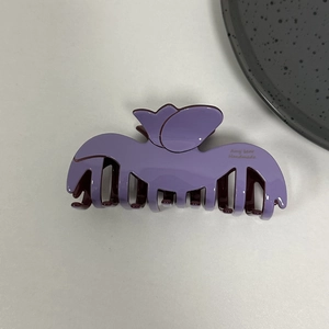 Detailed top view of a lavender tulip acetate hair claw clip with polished finish