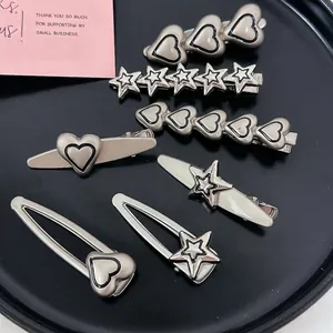 Set di fermagli per capelli in metallo opaco argento a forma di cuore e stella