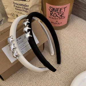 Cerchietti eleganti neri e bianchi con stelle in metallo per uno styling capelli chic