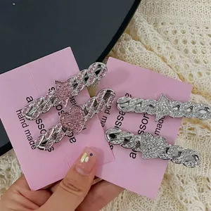Y2K silver metal star and heart hair clips with glittering rhinestones and Cuban link texture