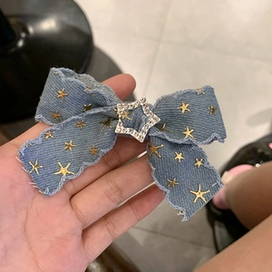 Retro denim bow hair clip with gold star pattern and rhinestone star buckle Y2K style