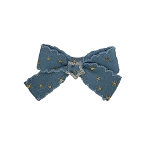 Retro denim bow hair clip with gold star prints and sparkling rhinestone accents in Y2K style