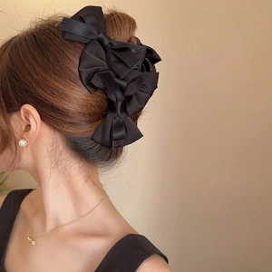 Elegant large black satin layered bow hair claw clip for bun hairstyles on women