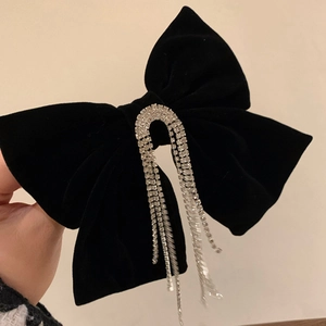 Barrette à nœud papillon en velours noir élégante avec glands en strass argentés