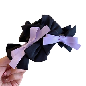 Elegant black layered silk bow hair claw clip with light purple ribbon accents