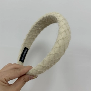 French vintage knitted headband with beige diamond quilting and handmade tag