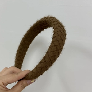Close-up of brown quilted plush headband featuring French vintage autumn and winter texture