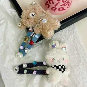 Plush bunny and bear hair clips with rhinestones on denim base for cute styling