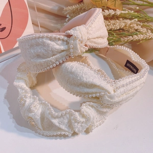 Elegant cream fabric headbands with pearls and handmade knot detail for women