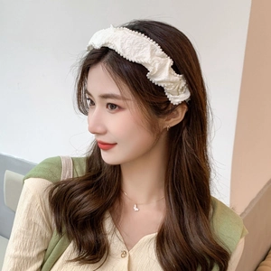 Elegant creamy white pleated headband with pearl beads for a high cranium aesthetic look