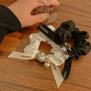 Elegant satin bow scrunchies set with pearl camellia charm in black and white colors