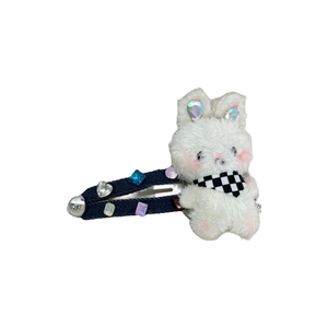 Cute plush bunny hair clip with sparkling rhinestones and denim fabric on a white background
