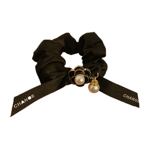 Elegant black silk scrunchie with camellia pearl charm and white CHANCE ribbon