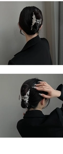Detail view of a silver liquid metal butterfly hair claw clip worn in a stylish hairstyle
