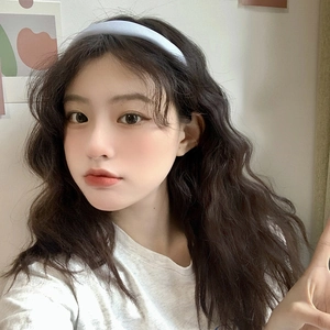 Chic light blue wide sponge headband with wavy design for a high-crown hair styling look