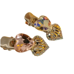 Set of two Y2K sparkling crystal heart hair clips in blue and pink with rhinestone edges