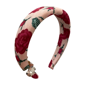 Padded floral headband with pink rose pattern and vintage wide-brimmed fabric design