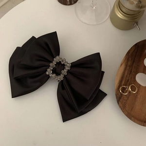 Elegant black satin ribbon hair clip with a sparkling square rhinestone buckle center