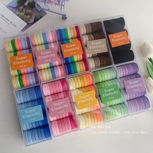 High elasticity multi-color hair ties set in clear boxes with a minimalist aesthetic