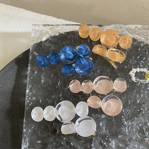 Fashionable resin bubble hair clips in multiple colors with pearl beaded rings on tray