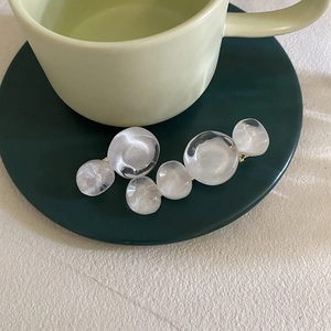 Retro transparent round bead hair clip for women featuring cream resin spheres on green plate