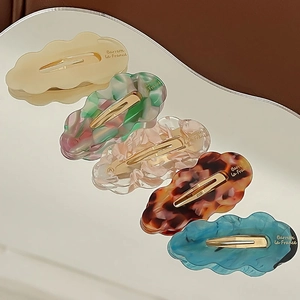 Five-piece cloud shaped hair clips in diverse marble colors with gold metal backing