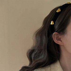 Elegant vintage black velvet headband with gold heart accents for women's hairstyle