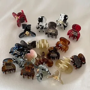 Set of mini tortoiseshell and marble hair claws for air bangs and side styling