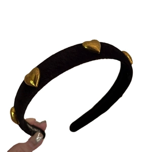Vintage black flocked headband with golden heart ornaments and retro aesthetic design