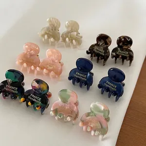 Set of 12 mini acetate claw clips with elegant tortoise shell and marble patterns
