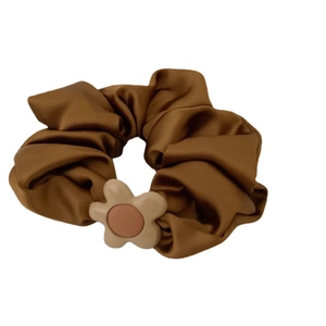 Elegant bronze brown silk scrunchie with a resin flower charm for stylish hair styling