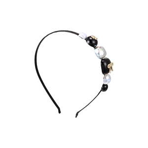 Elegant black headband with iridescent blocks and a golden metal bow accessory