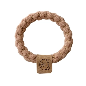 Elastic wave-shaped hair tie in dusty rose with a cute brown bear leather accent