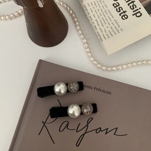 Elegant pair of black velvet hair clips featuring large pearls and gold-set crystals