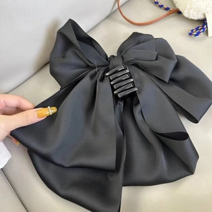 Elegant large black satin bow hair claw clip for women's half-up hairstyles