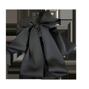 Elegant large black satin bow hair clip with multi-layered structure and silk texture