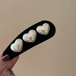 Retro black velvet BB hair clip with three cream white heart-shaped faux pearls