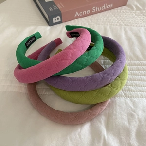 Quilted fabric plaid sponge headbands in multiple pastel colors with handmade label